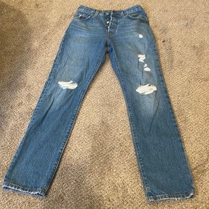 Dark wash lightly ripped levi jeans